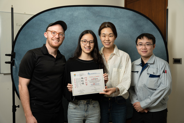 A group photo of Tiffany and the researchers (Arthur, Youngah, and Aaron) on completion of the HKSL Lessons. Tiffany is given the certificate for attaining Level 3 proficiency.